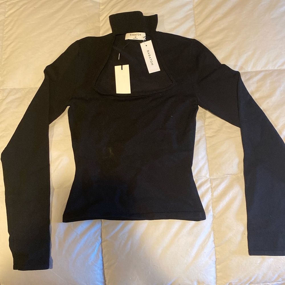 Woman’s black turtle neck with open chest